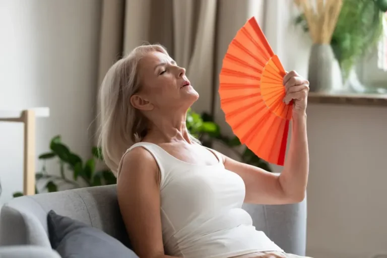 Woman fanning herself in heat