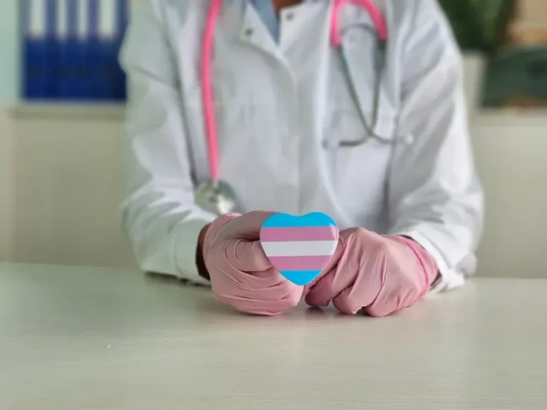 Transgender pride heart held by hands