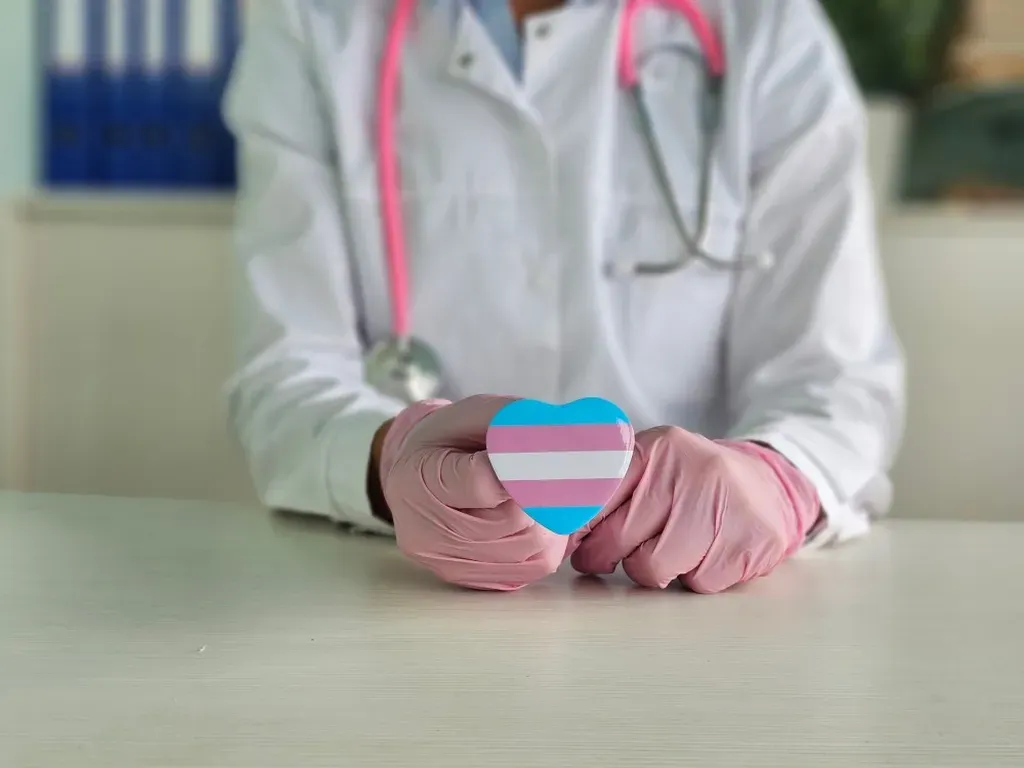 Transgender pride heart held by hands