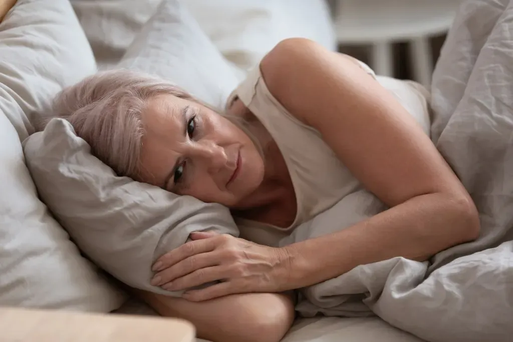 Woman resting in bed