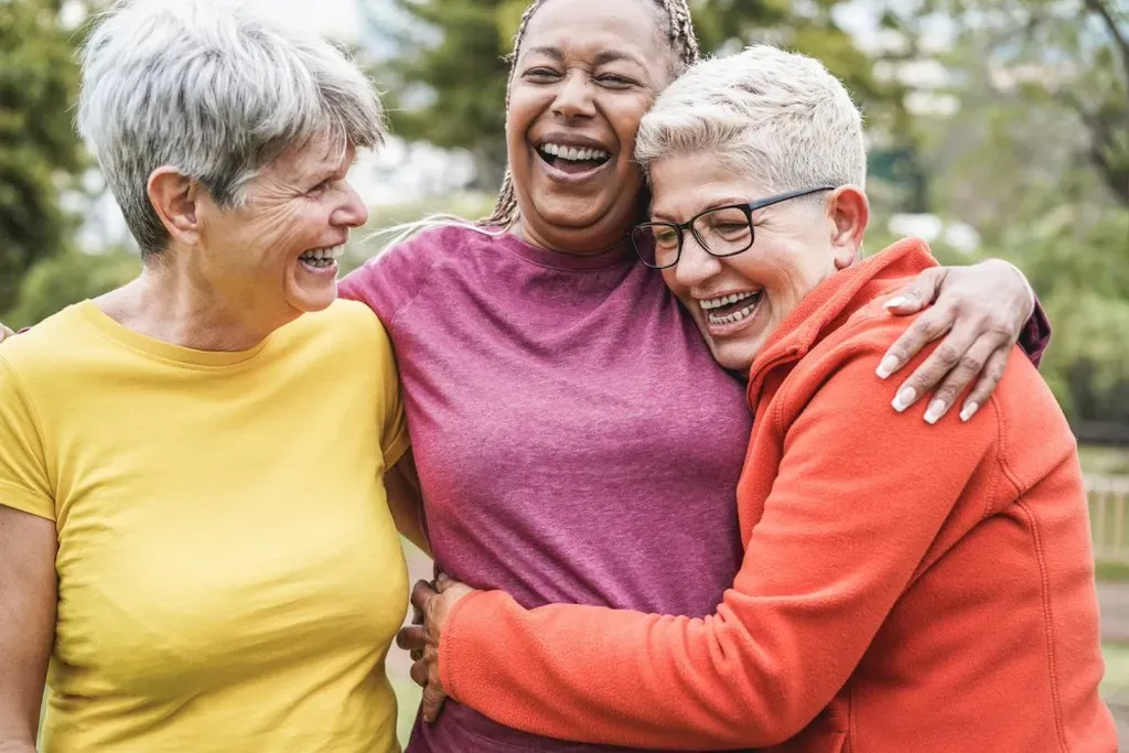 Happy women laughing together outdoors