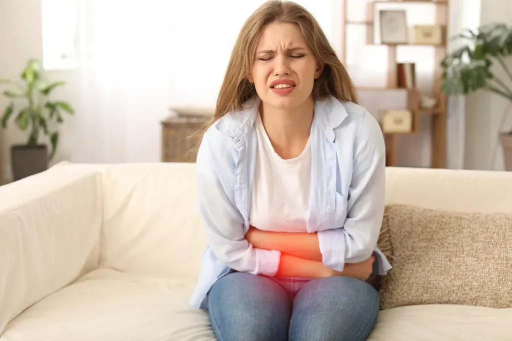 Woman experiencing stomach pain