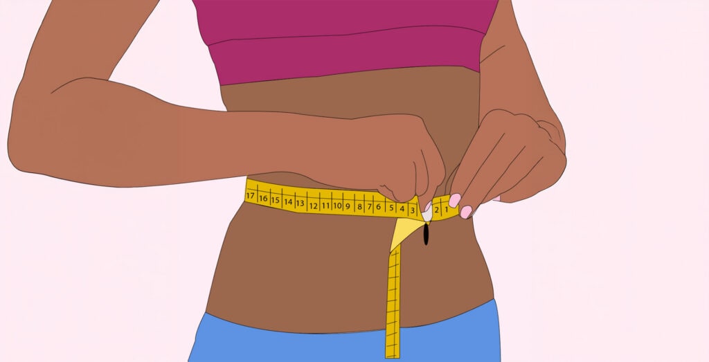 Woman measuring waist